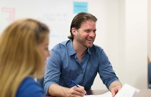 Man in business suit smiling